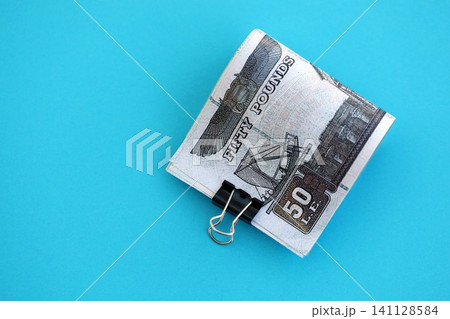Egyptian pound money bills in big amount on blue. Finance and banking concept Egyptian pound money bills in big amount on blue. Finance and banking concept 141128584