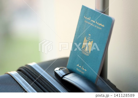 Egyptian passport on travel luggage. The concept of travel and vacation Egyptian passport on travel luggage. The concept of travel and vacation 141128589