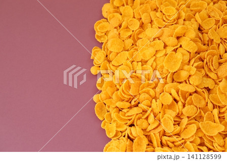 Background of breakfast cereals in big amount on purple background, top view Background of breakfast cereals in big amount on purple background, top view 141128599