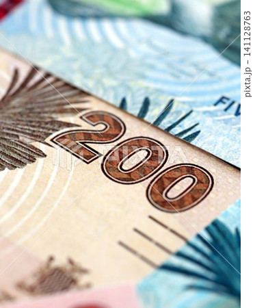 Zambian kwacha money bills pile on table. Zambia banknotes of ZMW currency close up 141128763