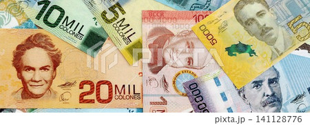 Costa Rican colon money bills pile on table. Costa Rica banknotes of CRC currency close up 141128776