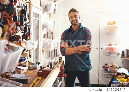 Tools, smile and portrait of man in workshop for furniture, manufacturing and small business production. Male person, happy and handyman with equipment for renovation, maintenance or remodeling Tools, smile and portrait of man in workshop for furniture, manufacturing and small business production. Male person, happy and handyman with equipment for renovation, maintenance or remodeling 141129845