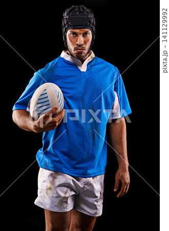 Rugby, portrait and man in studio for fitness, competition and sportswear in isolated dark background. Ball, player and young male athlete with confidence for professional sport, workout or exercise 141129992