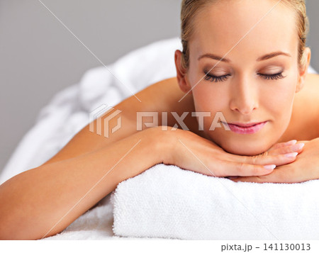 Woman, massage and spa for zen and treatment, destress and wellness for acupressure at luxury resort. Serene, peace and calm with eyes closed for stress relief, self care service and holistic healing 141130013