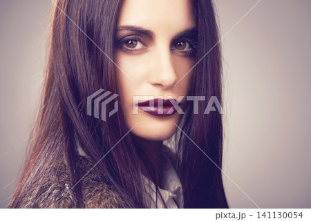 Studio, model and portrait with makeup, fur and beauty for natural proud attitude. Woman, cosmetics and clothes for confidence, glamour and elegance for chic fashionista isolated on white background 141130054