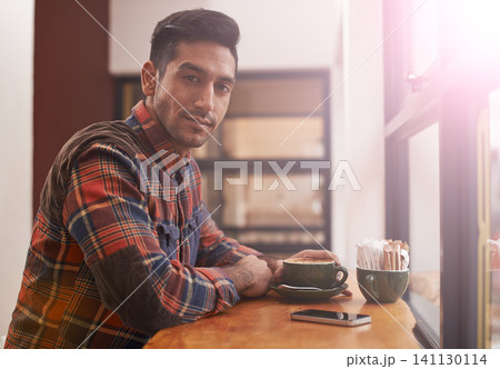 Man, portrait and coffee by window for morning, breakfast or drink at indoor cafe or restaurant. Male person or freelancer with smile for latte, customer service or cappuccino at cafeteria or shop Man, portrait and coffee by window for morning, breakfast or drink at indoor cafe or restaurant. Male person or freelancer with smile for latte, customer service or cappuccino at cafeteria or shop 141130114