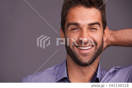 Studio, smile and portrait of man with confidence for good mood, pride and positivity on mockup. Cheerful, male person and face with happiness for satisfaction, joy and relax on gray background 141130128