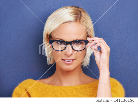 Woman, portrait and glasses for vision and eye care, smart or intelligent with optometry on blue background. Frame, prescription lens and eyewear choice for help with eyesight, visual and spectacles Woman, portrait and glasses for vision and eye care, smart or intelligent with optometry on blue background. Frame, prescription lens and eyewear choice for help with eyesight, visual and spectacles 141130150