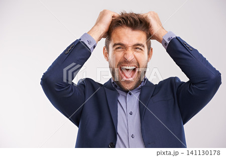 Entrepreneur, man and stream or frustrated in studio on white background with furious, anger and upset. Portrait, businessman and hands in head to shout or angry with company deadline in suit. 141130178