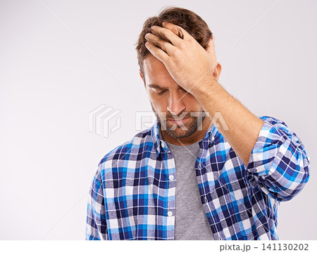 Man, hand and headache pain with fatigue stress on white background for migraine, burnout or mockup space. Male person, anxiety and brain fog tension in studio with vertigo health, wellness or dizzy 141130202