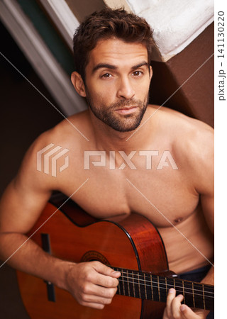 Portrait, home and guitar with man, topless and training with talent or sound with musician. Face, person or apartment with guy or string instrument for practice or confidence with hobby or shirtless Portrait, home and guitar with man, topless and training with talent or sound with musician. Face, person or apartment with guy or string instrument for practice or confidence with hobby or shirtless 141130220
