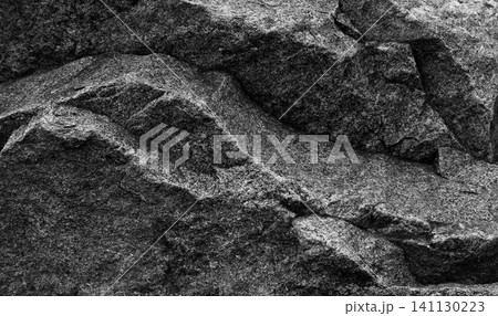 Texture of rough gray granite stone with quartz inclusions. Quality stock photo of raw granite surface Texture of rough gray granite stone with quartz inclusions. Quality stock photo of raw granite surface 141130223