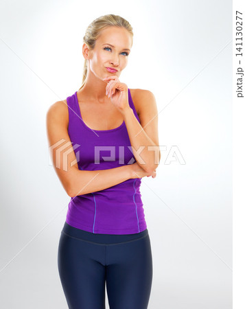 Woman, thinking and fitness in studio with idea for healthy lifestyle, wellness or reflection on exercise. Athlete, person and thoughtful for workout, training and problem solving on white background Woman, thinking and fitness in studio with idea for healthy lifestyle, wellness or reflection on exercise. Athlete, person and thoughtful for workout, training and problem solving on white background 141130277