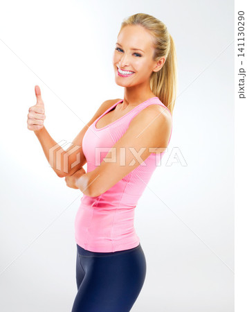 Studio, portrait and woman with thumbs up for exercise, personal trainer and support or vote for fitness. Adult, female person and girl with smile for workout, happiness and thank you for training Studio, portrait and woman with thumbs up for exercise, personal trainer and support or vote for fitness. Adult, female person and girl with smile for workout, happiness and thank you for training 141130290