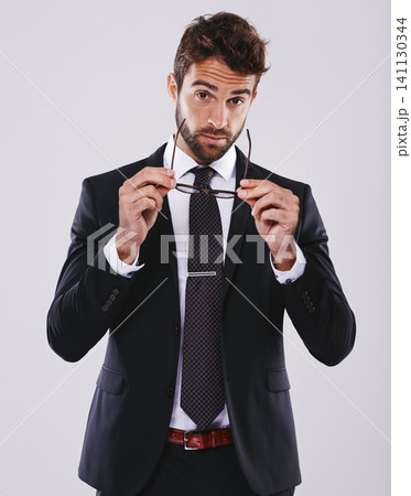 Portrait, studio and businessman with suit, glasses for vision on lawyer or question expression and necktie. Corporate man person, professional with cool confidence, mockup and legal consultant Portrait, studio and businessman with suit, glasses for vision on lawyer or question expression and necktie. Corporate man person, professional with cool confidence, mockup and legal consultant 141130344