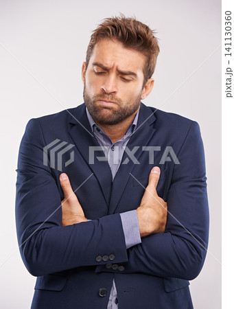Corporate, man and sad in studio with arms crossed on white background with deadline and business concern. Upset, entrepreneur and frustrated or disappointed with company growth and professional Corporate, man and sad in studio with arms crossed on white background with deadline and business concern. Upset, entrepreneur and frustrated or disappointed with company growth and professional 141130360