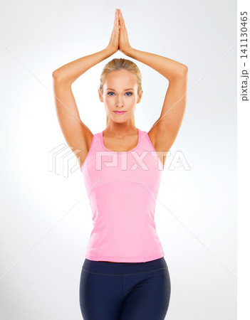 Woman, portrait and yoga pose with stretching, zen and wellness in a studio. Health, calm and female person with pilates and healthy practice with a white background and confidence from wellbeing 141130465