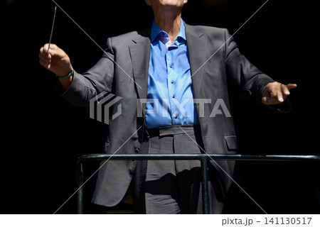 Orchestra, concert and teacher for music in black background, event and director professional. Person in suit, mature and creative in art, artist of violin and education for maestro in dark, musician 141130517