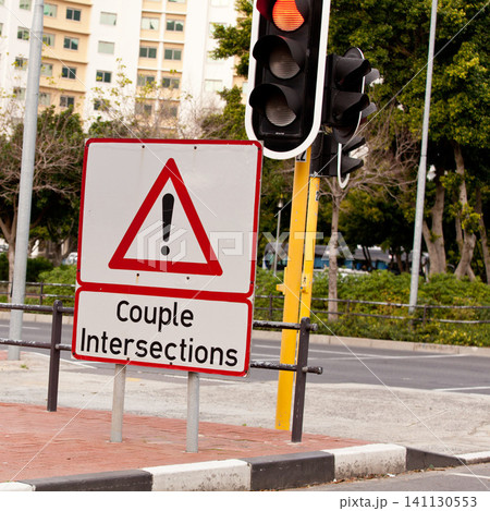 Road sign, caution and traffic light or intersection city for street safety or transportation direction, warning or outdoor. Notice, delay and urban downtown in America or driving, protocol or symbol Road sign, caution and traffic light or intersection city for street safety or transportation direction, warning or outdoor. Notice, delay and urban downtown in America or driving, protocol or symbol 141130553