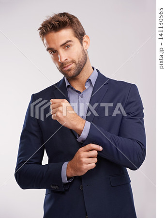 Portrait, studio and businessman with smile, confidence and corporate fashion with pride. Salesman, consultant or entrepreneur man in business suit with stylish gentleman clothes on white background 141130565