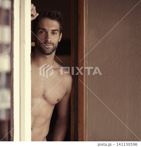 Portrait, home and muscular with man, topless and happy with wellness and healthy with confidence and window. Face, workout and guy with body and apartment with fitness and shirtless with exercise 141130596