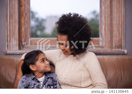 Love, mother and daughter in family home, living room and smile for bonding or affection. Relax, happy and young girl with parent on sofa with child, relationship and support or protection with hug Love, mother and daughter in family home, living room and smile for bonding or affection. Relax, happy and young girl with parent on sofa with child, relationship and support or protection with hug 141130645