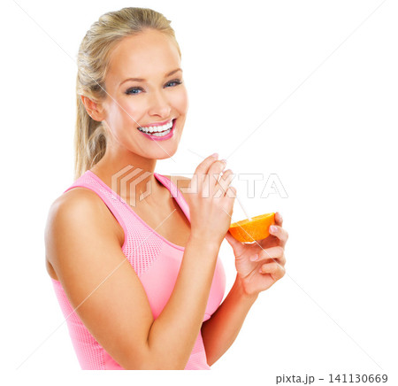 Woman, portrait and drinking an orange in studio for vitamin c, organic diet and natural nutrition with smile. Fitness, person and straw with fruit to lose weight and healthy body on white background Woman, portrait and drinking an orange in studio for vitamin c, organic diet and natural nutrition with smile. Fitness, person and straw with fruit to lose weight and healthy body on white background 141130669