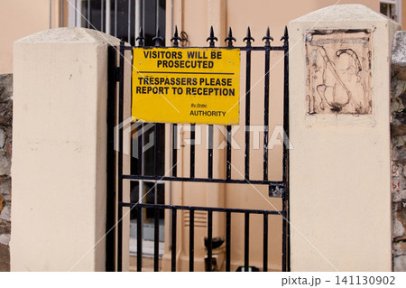 Sign, outdoor and warning with gate, building and authority with board and street with design. Notice, urban town and outside with road or safety with protection and review with information or poster 141130902