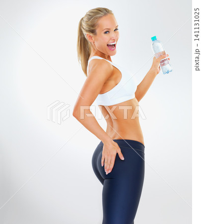 Studio, athlete and water for fitness, wellness and health with cardio training. Woman, workout and exercise for body, wellbeing and weight loss with optimism and energy isolated on white background Studio, athlete and water for fitness, wellness and health with cardio training. Woman, workout and exercise for body, wellbeing and weight loss with optimism and energy isolated on white background 141131025