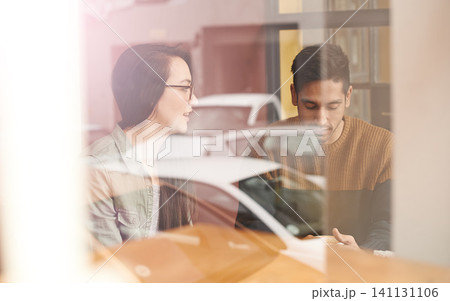 Couple, relax and date with communication at cafe for conversation, bonding or romance at indoor restaurant. Man and woman with smile by window and enjoying social, chatting or talking at coffee shop Couple, relax and date with communication at cafe for conversation, bonding or romance at indoor restaurant. Man and woman with smile by window and enjoying social, chatting or talking at coffee shop 141131106