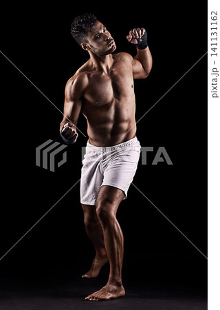 Man, boxer and portrait in studio for fight, fitness and warrior training on black background. Person, athlete and strong muscles for workout or exercise, health and ready for battle or competition 141131162