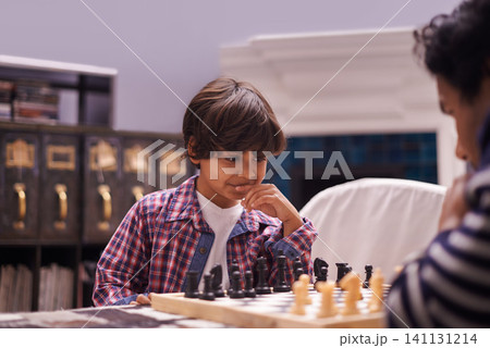 Child, father and chess game with strategy or checkmate move with knight, king or queen. Son, parent and thinking for competition learning or decision thoughts for playing, contest or problem solving Child, father and chess game with strategy or checkmate move with knight, king or queen. Son, parent and thinking for competition learning or decision thoughts for playing, contest or problem solving 141131214