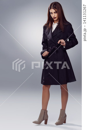 Coat, fashion space or woman in portrait or studio for cool style, trendy jacket or comfortable outfit. Chic, mockup or confident model in cozy heels or elegant winter clothing on grey background Coat, fashion space or woman in portrait or studio for cool style, trendy jacket or comfortable outfit. Chic, mockup or confident model in cozy heels or elegant winter clothing on grey background 141131267