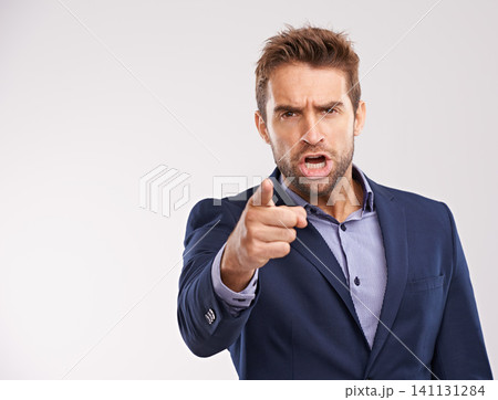 Entrepreneur, man and shout with pointing in studio white background to blame, angry and disappointed. Portrait, businessman and furious or upset in suit and professional with start up company Entrepreneur, man and shout with pointing in studio white background to blame, angry and disappointed. Portrait, businessman and furious or upset in suit and professional with start up company 141131284