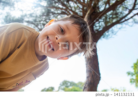 Children play and explore near the beach scene Children play and explore near the beach scene 141132131