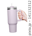 Female Hand Holding 40 oz light purple tumbler. Tumbler With Handle, Travel Mug Straw Covers Cup with Lid 141132312