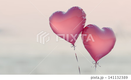 Two glossy heart balloons on a soft blue sky background. Shine through heart balloons. Evening sunset light. 3d rendering Two glossy heart balloons on a soft blue sky background. Shine through heart balloons. Evening sunset light. 3d rendering 141132389
