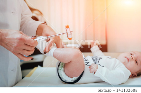 Neurologist diagnosing little boy. Pediatric Neurologist diagnosing little boy. Pediatric 141132688