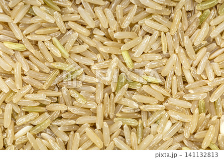 Close up of brown rice and white rice Hom Mali (jasmine) grains, natural texture background for food, cooking, health, and diet themes Close up of brown rice and white rice Hom Mali (jasmine) grains, natural texture background for food, cooking, health, and diet themes 141132813