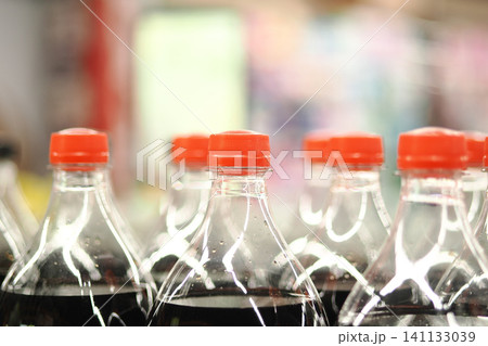 Bottles of soda create a colorful display in a market Bottles of soda create a colorful display in a market 141133039