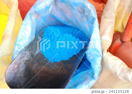 Vibrant blue powder shines in colorful art supplies 141133129