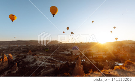 Open Air Museum. Flying hot air balloons rise in sunrise Cappadocia. Goreme National Park Turkey. Open Air Museum. Flying hot air balloons rise in sunrise Cappadocia. Goreme National Park Turkey. 141133209