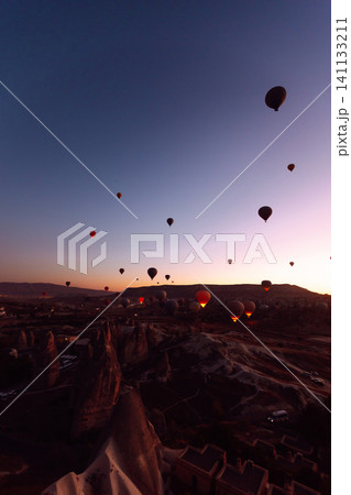 Open Air Museum. Flying hot air balloons rise in sunrise Cappadocia. Goreme National Park Turkey. Open Air Museum. Flying hot air balloons rise in sunrise Cappadocia. Goreme National Park Turkey. 141133211
