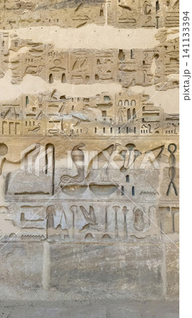 Beautiful bas-reliefs and ancient hieroglyphs from the mortuary temple of Ramesses III at Medinet Habu, Luxor, Egypt. Beautiful bas-reliefs and ancient hieroglyphs from the mortuary temple of Ramesses III at Medinet Habu, Luxor, Egypt. 141133394