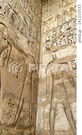 Beautiful bas-reliefs and ancient hieroglyphs from the mortuary temple of Ramesses III at Medinet Habu, Luxor, Egypt. Beautiful bas-reliefs and ancient hieroglyphs from the mortuary temple of Ramesses III at Medinet Habu, Luxor, Egypt. 141133533