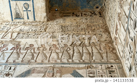 Beautiful bas-reliefs and ancient hieroglyphs from the mortuary temple of Ramesses III at Medinet Habu, Luxor, Egypt. 141133538