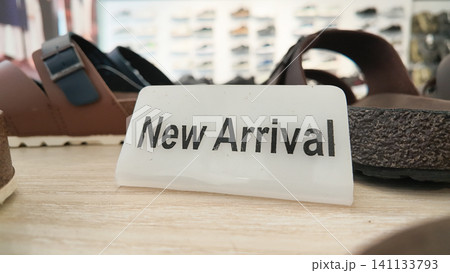 New arrivals of shoes on display in a store New arrivals of shoes on display in a store 141133793