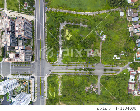 Aerial view of modern road networks and lush green spaces in Ho Chi Minh City, Vietnam Aerial view of modern road networks and lush green spaces in Ho Chi Minh City, Vietnam 141134039