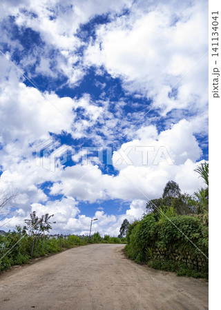 A road with a blue sky above it 141134041