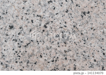 A stone wall with a lot of small holes A stone wall with a lot of small holes 141134070